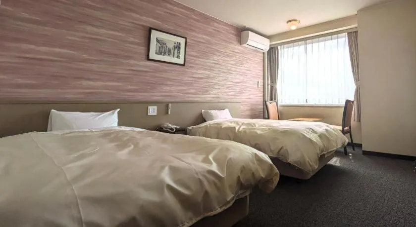 Bed in Mikuni Ocean Resort & Hotel