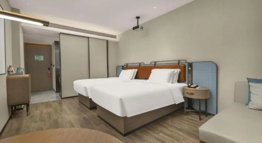 Bed in Echarm Hotel Changsha Huanghua Airport