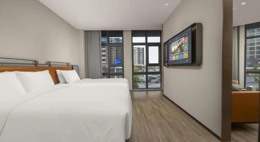 Bed in Echarm Hotel Changsha Huanghua Airport