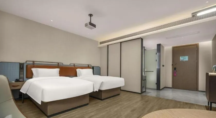 Bed in Echarm Hotel Changsha Huanghua Airport