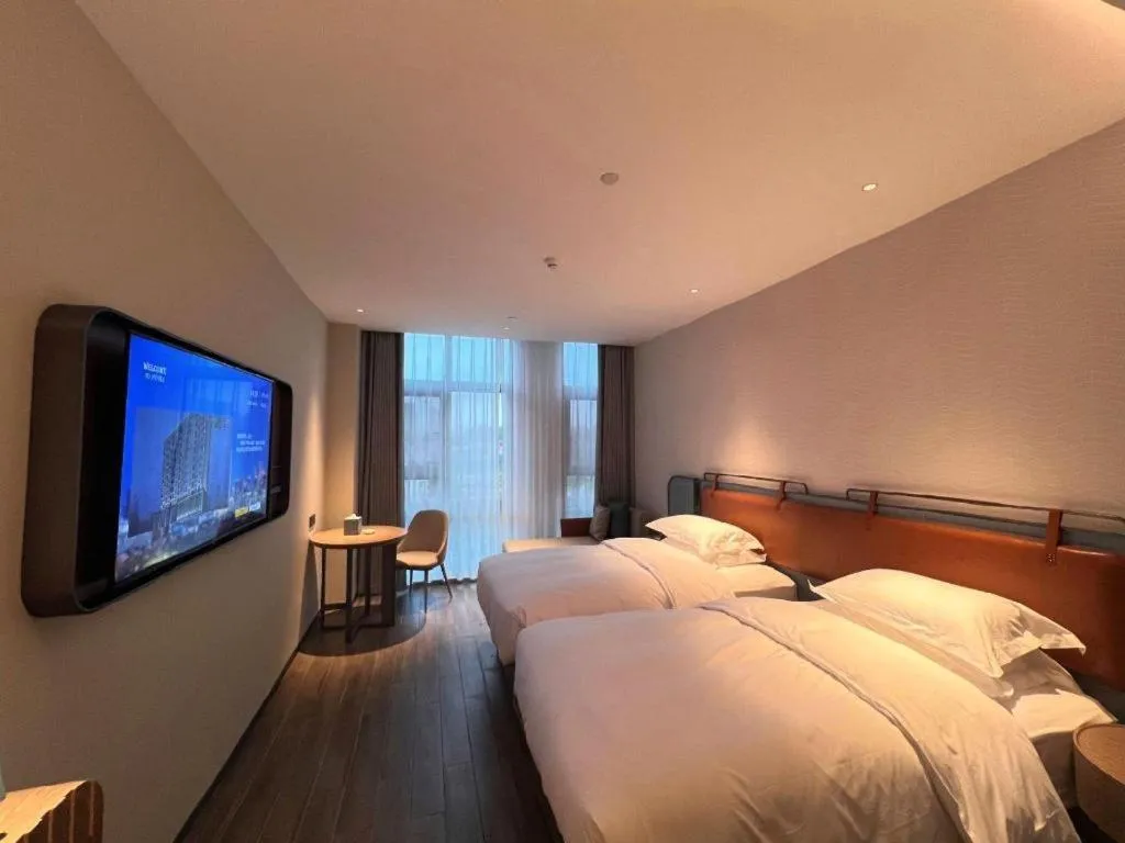 Bed in Echarm Hotel Changsha Huanghua Airport