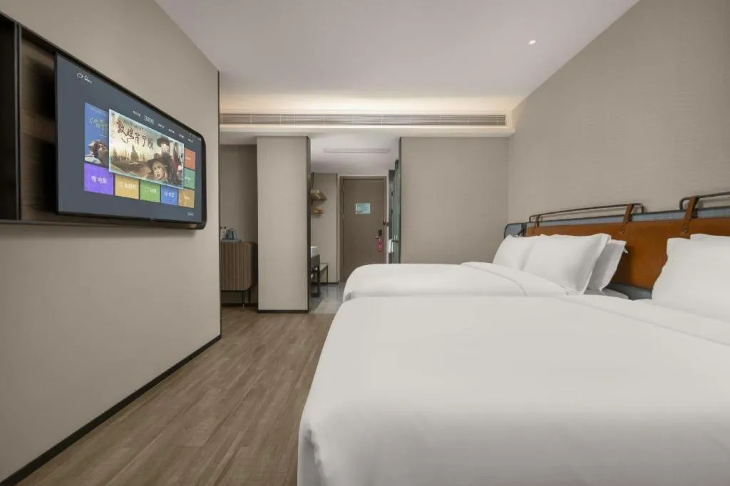 Bed in Echarm Hotel Changsha Huanghua Airport