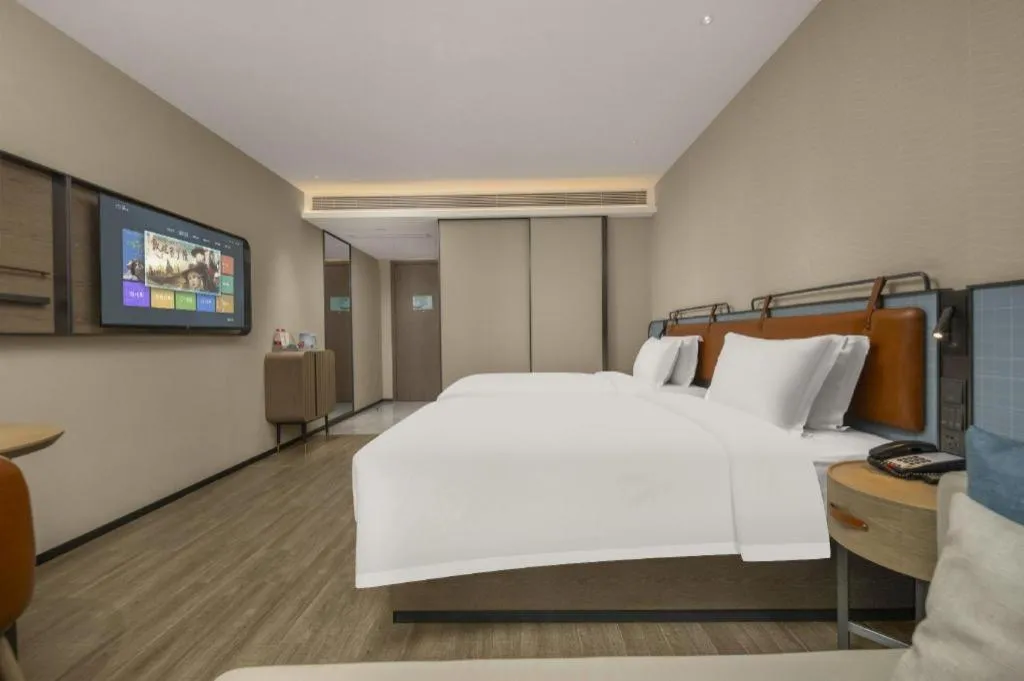 Bed in Echarm Hotel Changsha Huanghua Airport