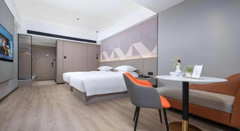 Bed in Borrman Hotel Yongzhou Lingling Ancient Town Government