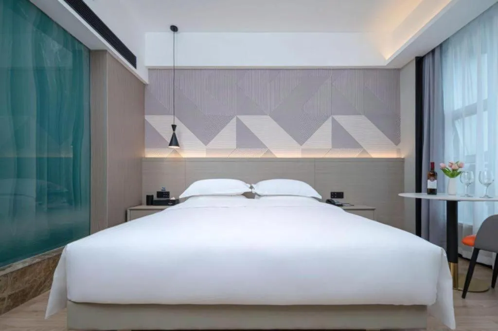 Bed in Borrman Hotel Yongzhou Lingling Ancient Town Government