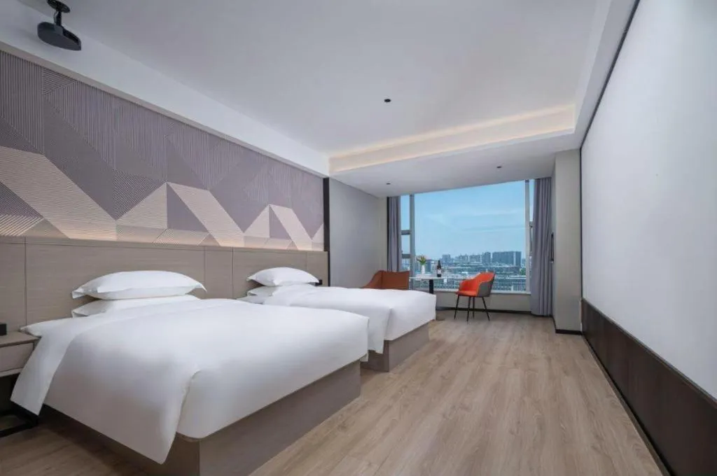 Bed in Borrman Hotel Yongzhou Lingling Ancient Town Government