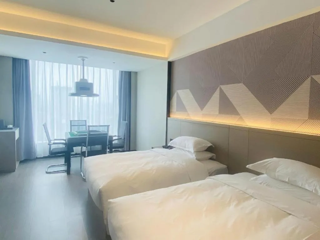 Bed in Borrman Hotel Yongzhou Lingling Ancient Town Government