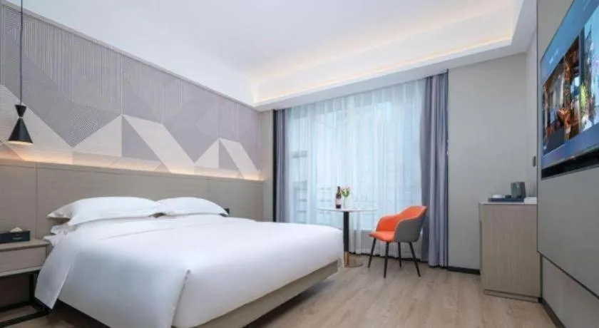 Bed in Borrman Hotel Yongzhou Lingling Ancient Town Government