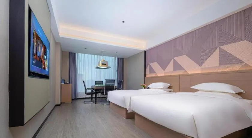 Bed in Borrman Hotel Yongzhou Lingling Ancient Town Government