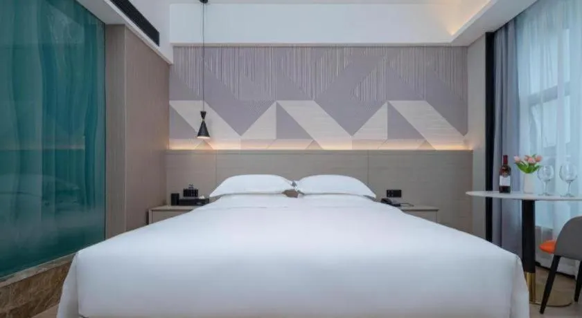 Bed in Borrman Hotel Yongzhou Lingling Ancient Town Government