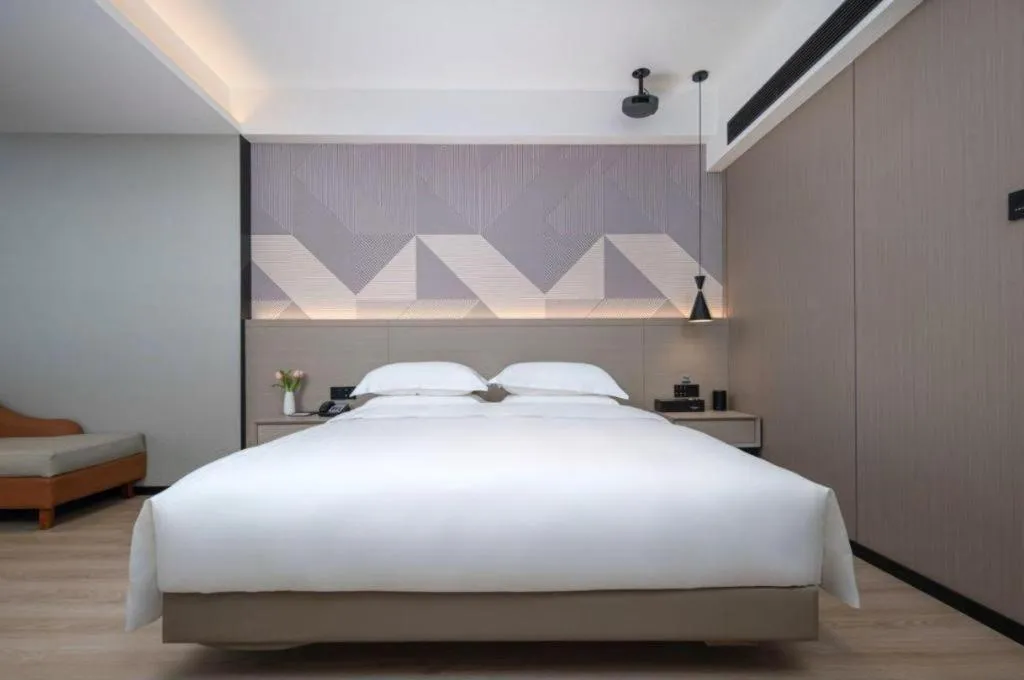 Bed in Borrman Hotel Yongzhou Lingling Ancient Town Government