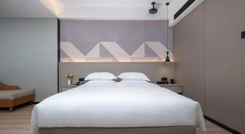 Bed in Borrman Hotel Yongzhou Lingling Ancient Town Government