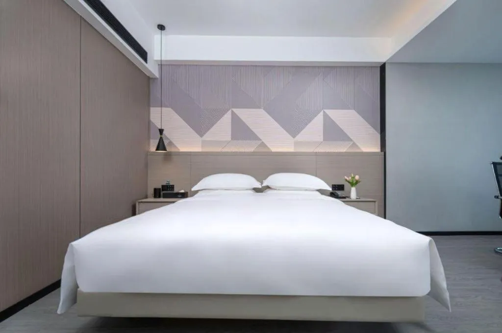 Bed in Borrman Hotel Yongzhou Lingling Ancient Town Government