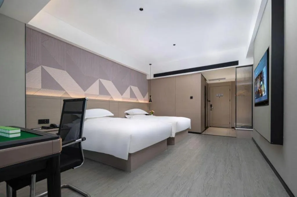 Bed in Borrman Hotel Yongzhou Lingling Ancient Town Government