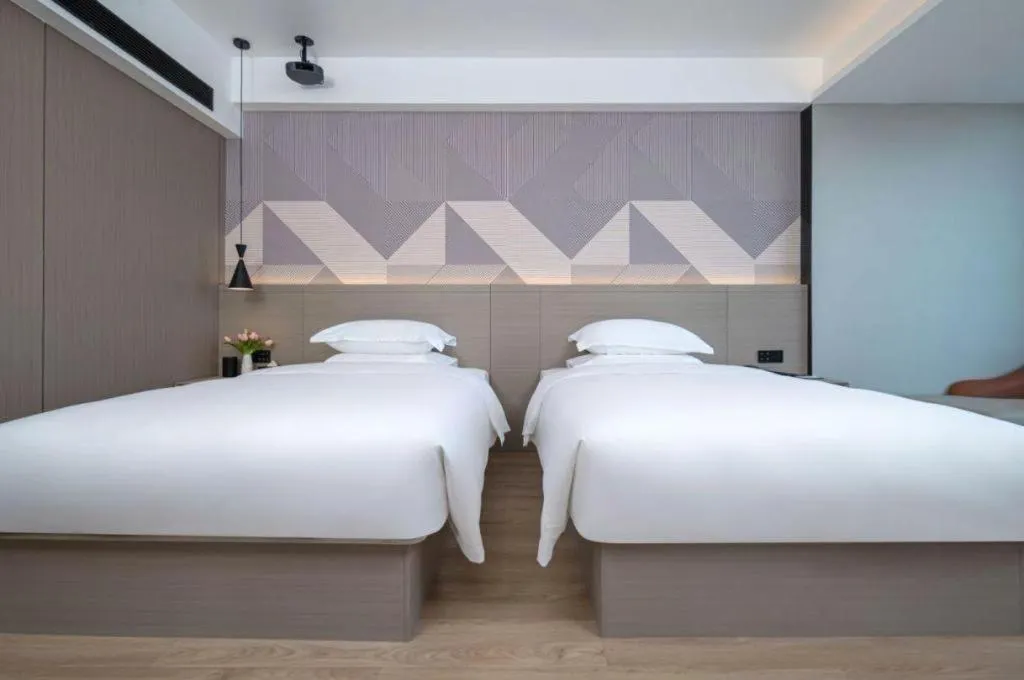 Bed in Borrman Hotel Yongzhou Lingling Ancient Town Government