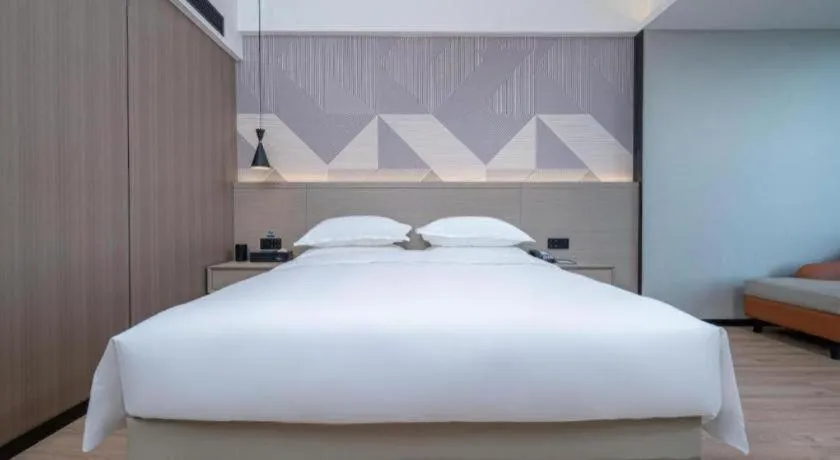 Bed in Borrman Hotel Yongzhou Lingling Ancient Town Government