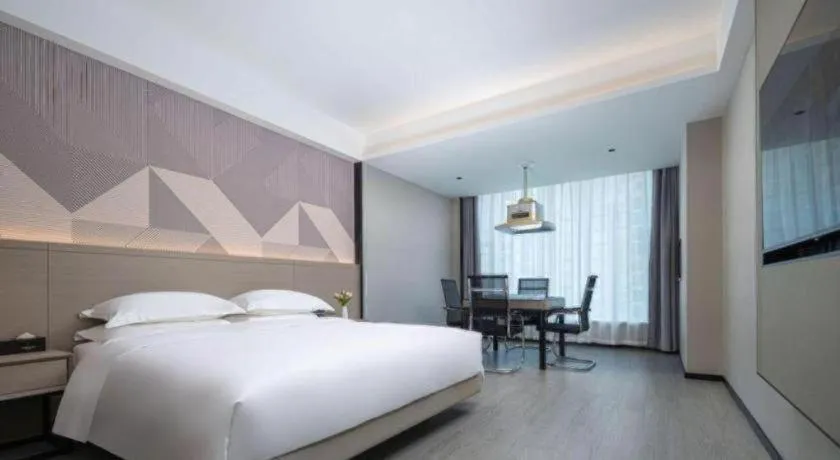 Bed in Borrman Hotel Yongzhou Lingling Ancient Town Government