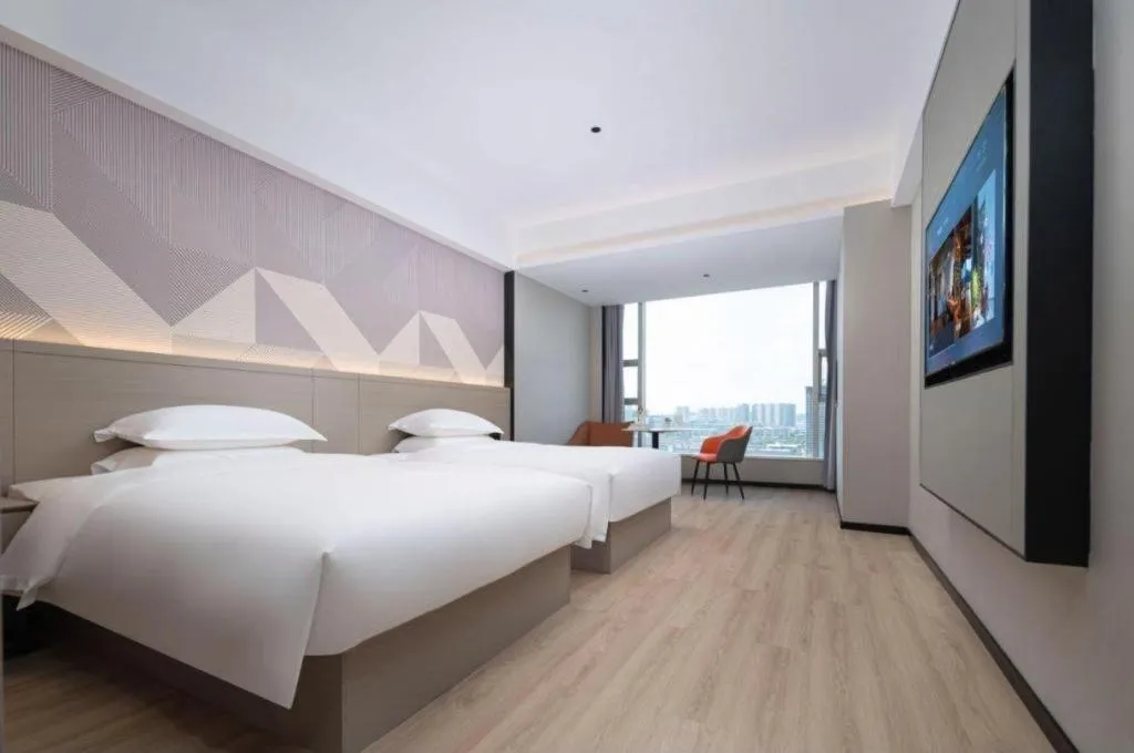 Bed in Borrman Hotel Yongzhou Lingling Ancient Town Government