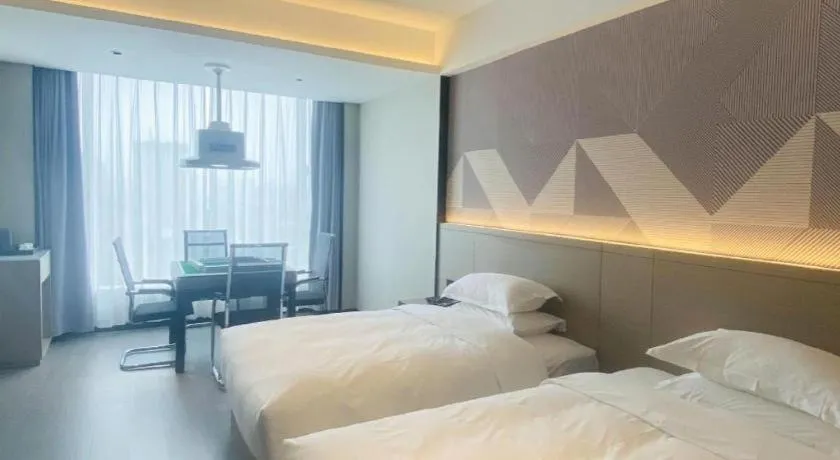 Bed in Borrman Hotel Yongzhou Lingling Ancient Town Government