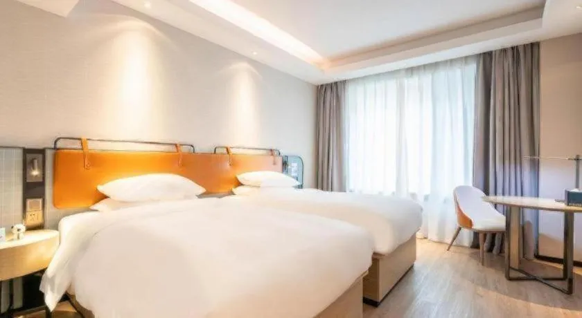 Bed in Echarm Hotel Guangzhou South Railway Station