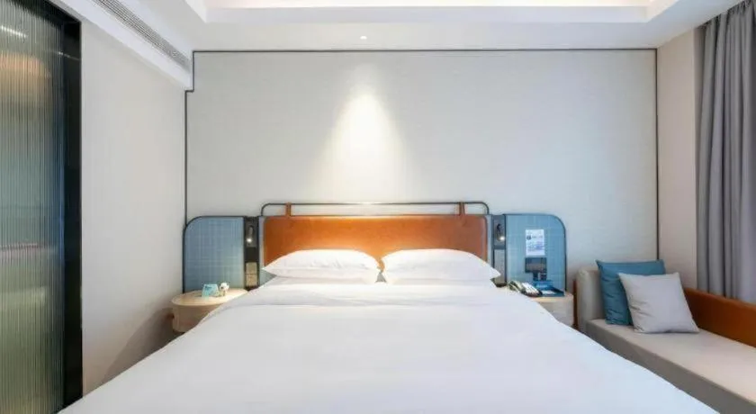 Bed in Echarm Hotel Guangzhou South Railway Station
