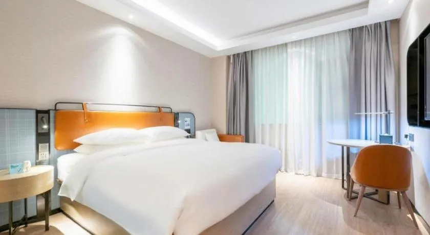 Bed in Echarm Hotel Guangzhou South Railway Station