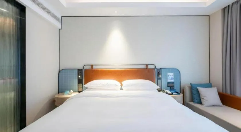 Bed in Echarm Hotel Guangzhou South Railway Station