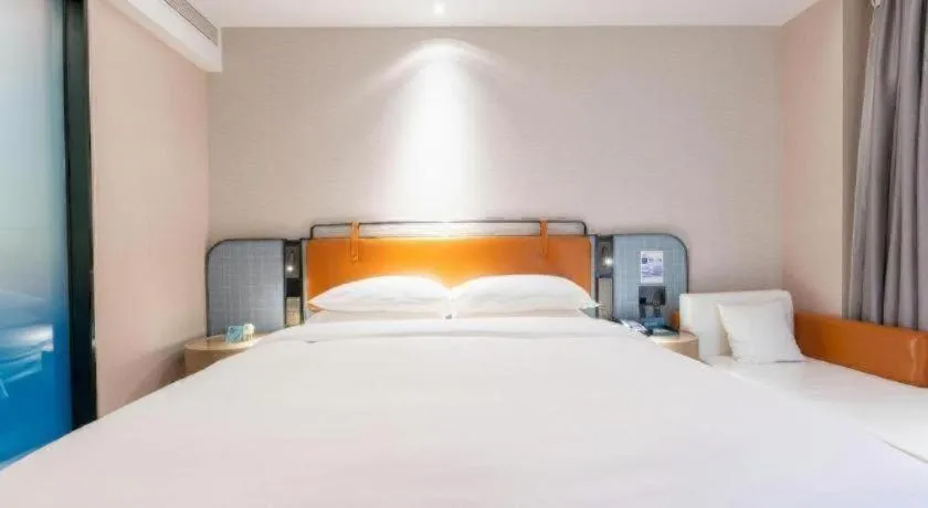 Bed in Echarm Hotel Guangzhou South Railway Station