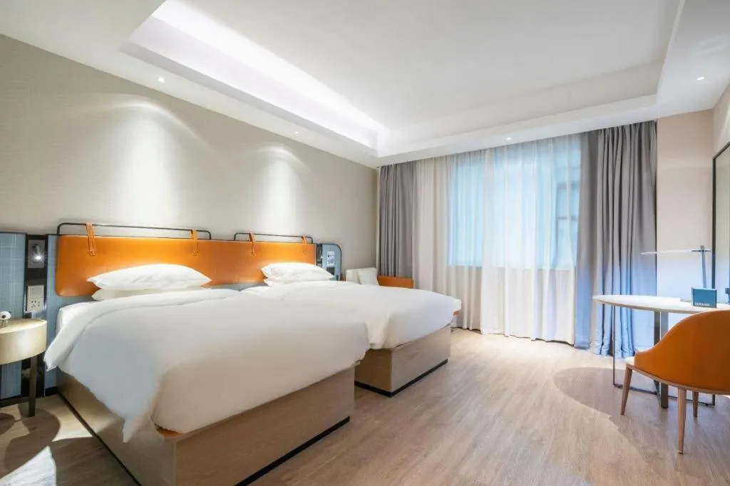 Bed in Echarm Hotel Guangzhou South Railway Station