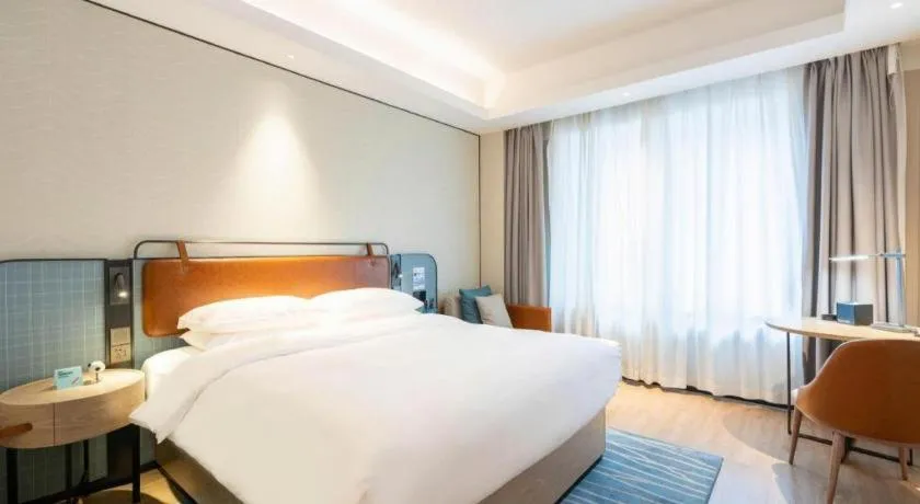 Bed in Echarm Hotel Guangzhou South Railway Station