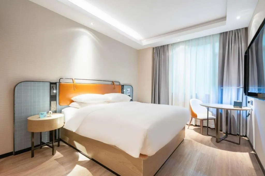 Bed in Echarm Hotel Guangzhou South Railway Station