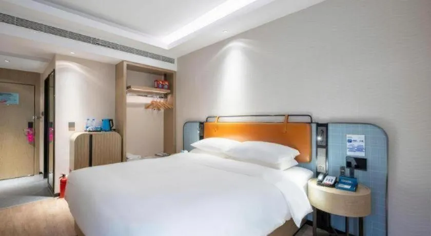 Bed in Echarm Hotel Guangzhou South Railway Station