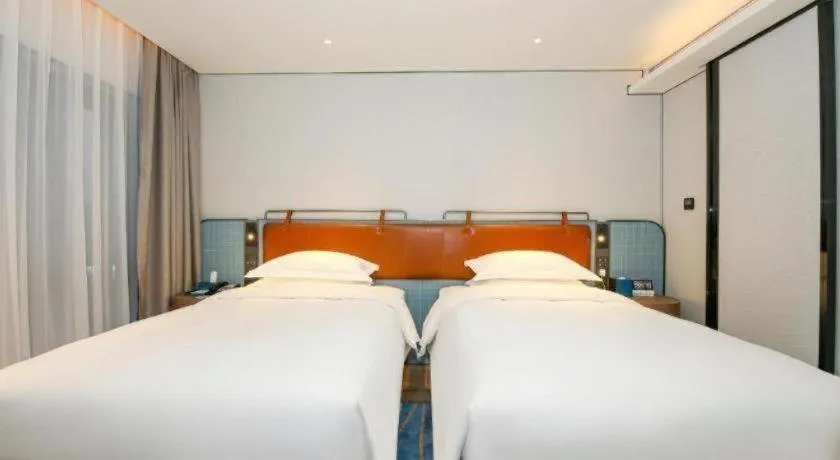 Bed in Echarm Hotel Guangzhou South Railway Station