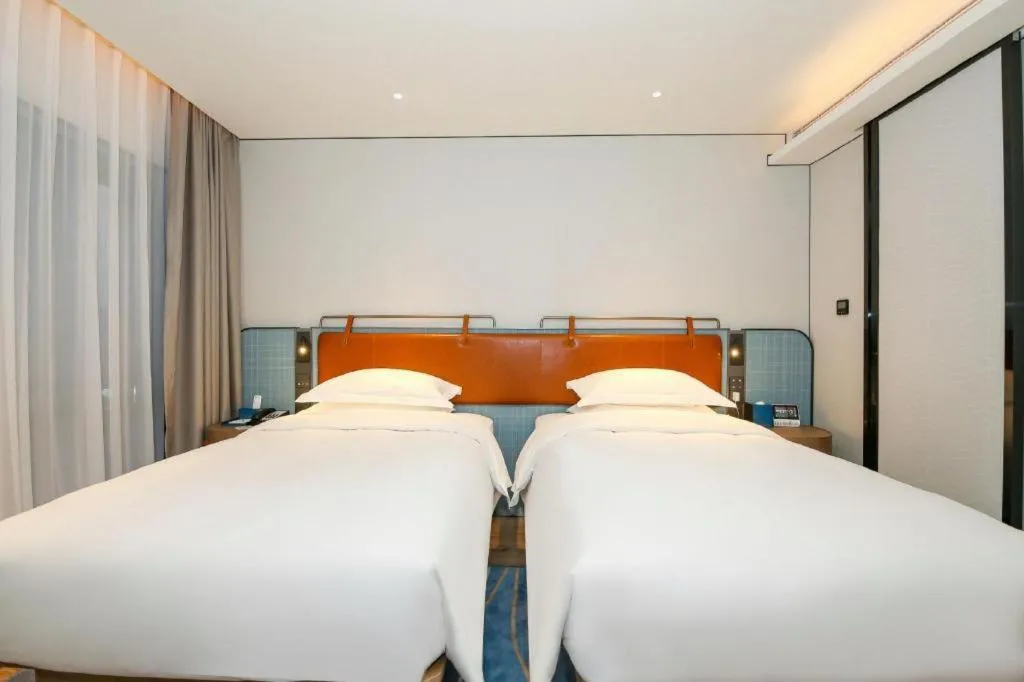 Bed in Echarm Hotel Guangzhou South Railway Station