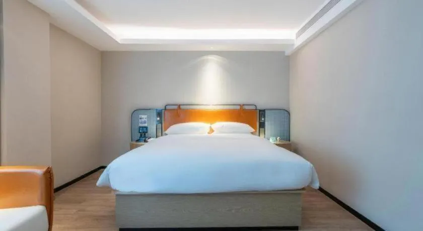 Bed in Echarm Hotel Guangzhou South Railway Station