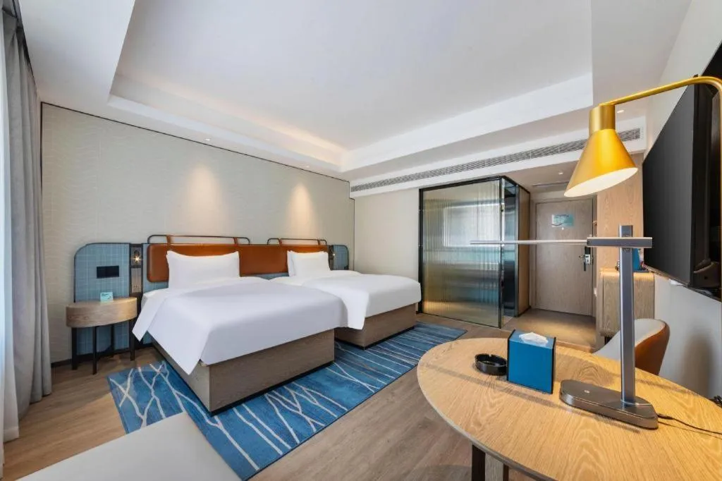 Bed in Echarm Hotel Guangzhou South Railway Station