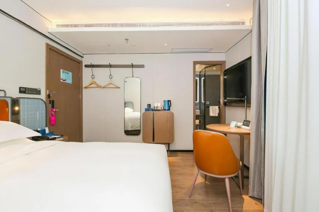 Bed in Echarm Hotel Guangzhou South Railway Station