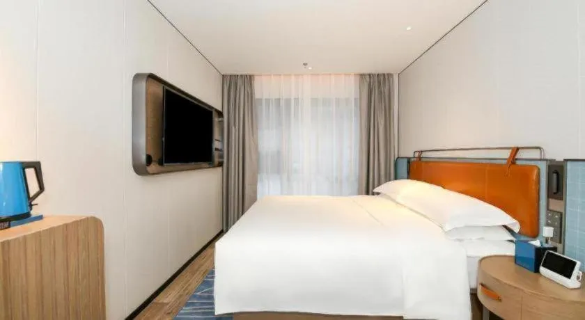 Bed in Echarm Hotel Guangzhou South Railway Station