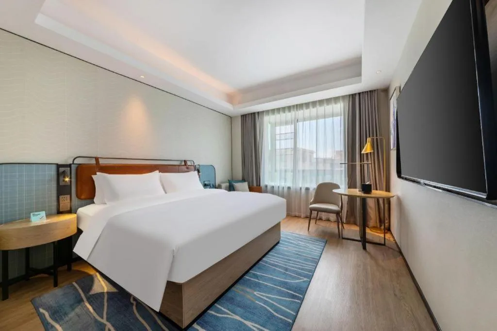 Bed in Echarm Hotel Guangzhou South Railway Station