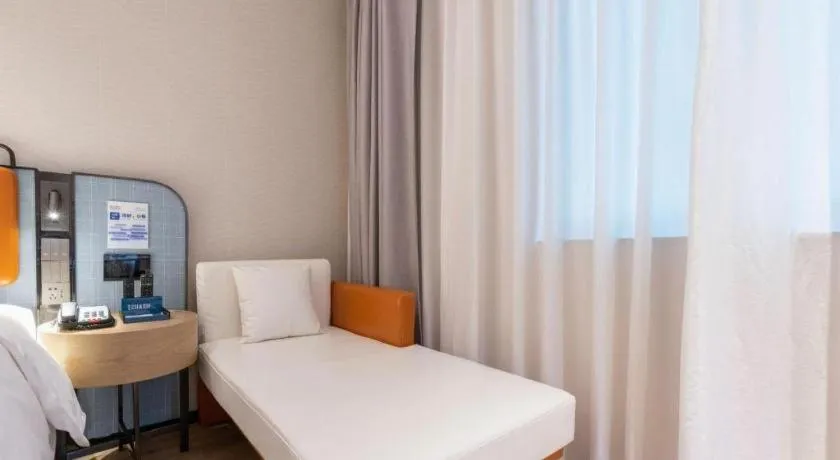 Bed in Echarm Hotel Guangzhou South Railway Station