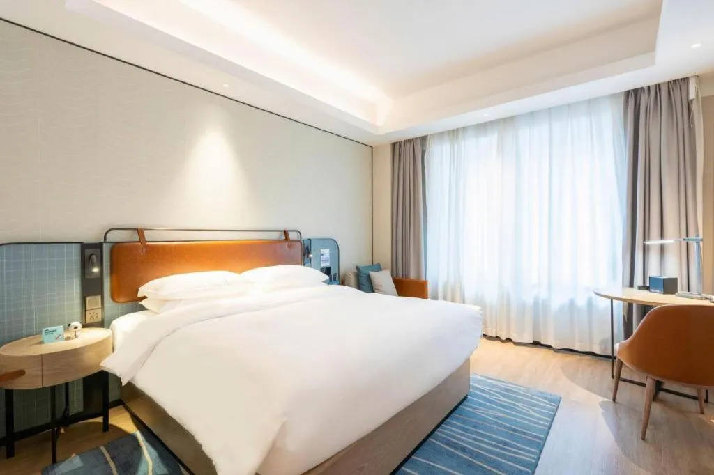 Bed in Echarm Hotel Guangzhou South Railway Station