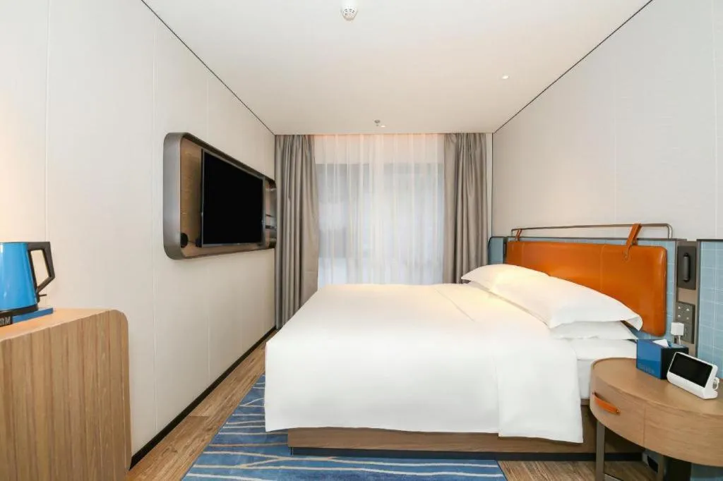 Bed in Echarm Hotel Guangzhou South Railway Station