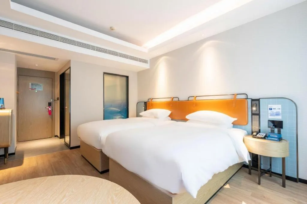 Bed in Echarm Hotel Guangzhou South Railway Station