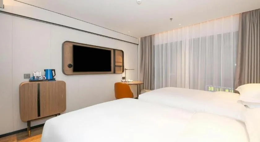 Bed in Echarm Hotel Guangzhou South Railway Station