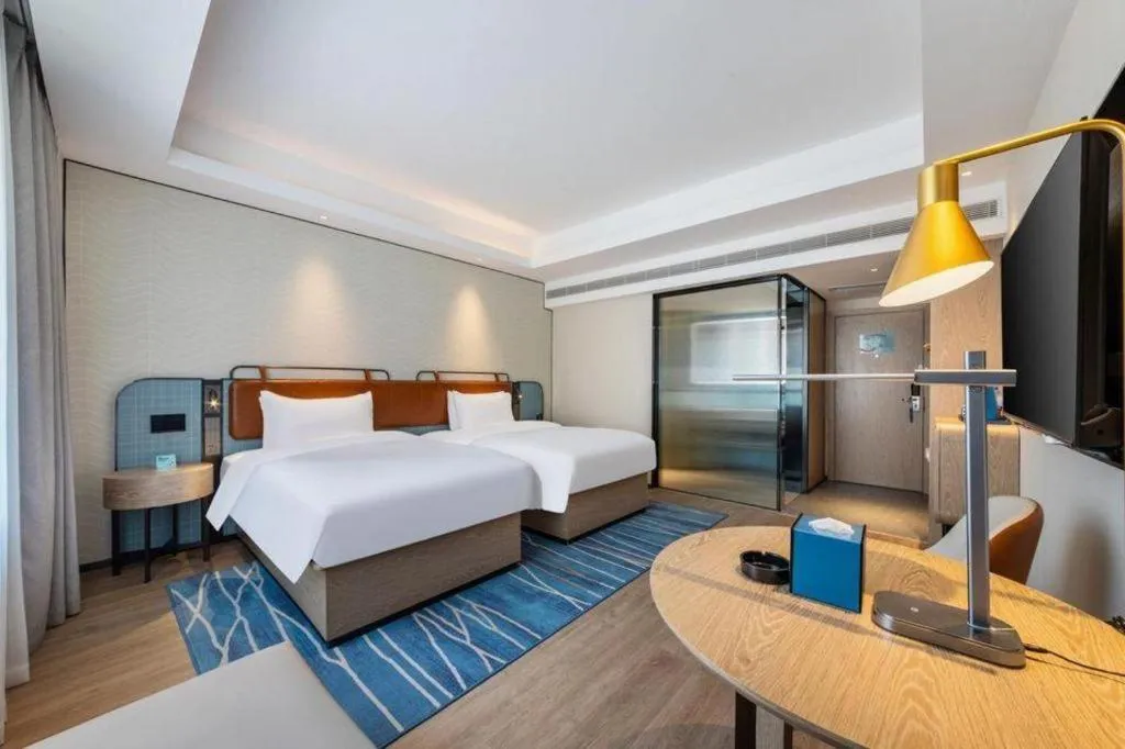 Bed in Echarm Hotel Guangzhou South Railway Station