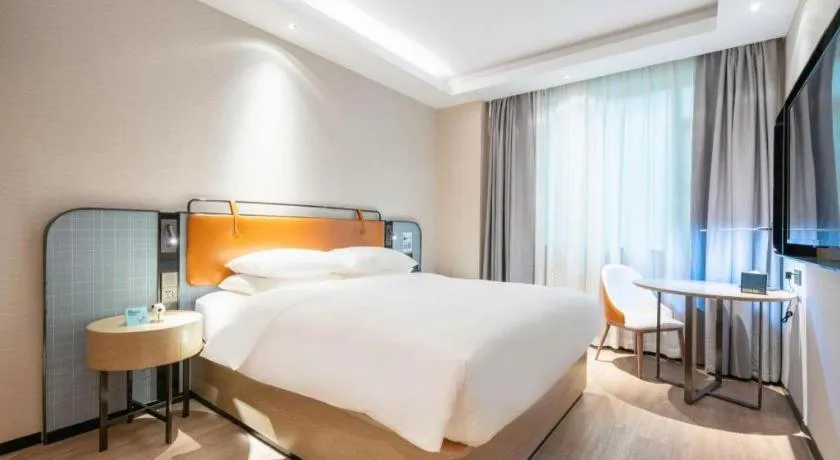 Bed in Echarm Hotel Guangzhou South Railway Station