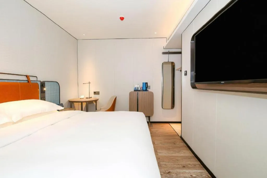 Bed in Echarm Hotel Guangzhou South Railway Station