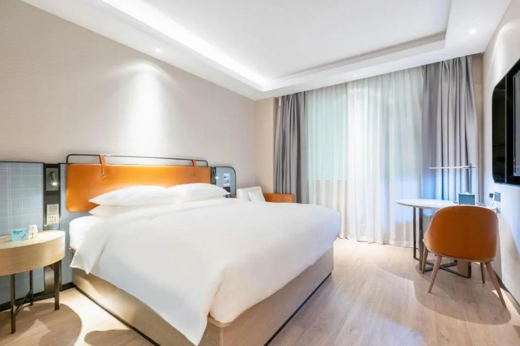 Bed in Echarm Hotel Guangzhou South Railway Station