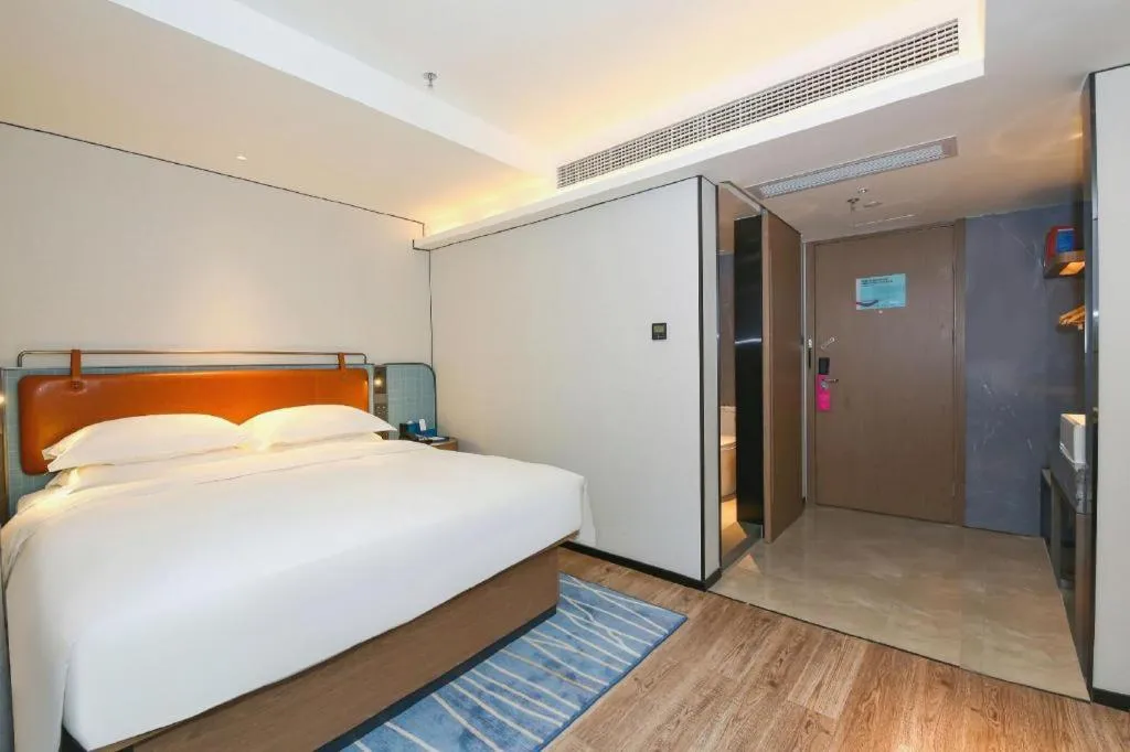 Bed in Echarm Hotel Guangzhou South Railway Station