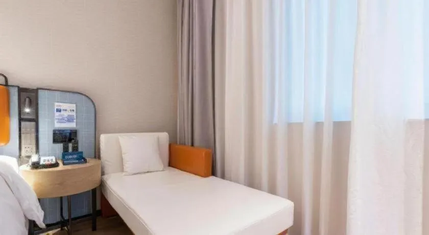 Bed in Echarm Hotel Guangzhou South Railway Station